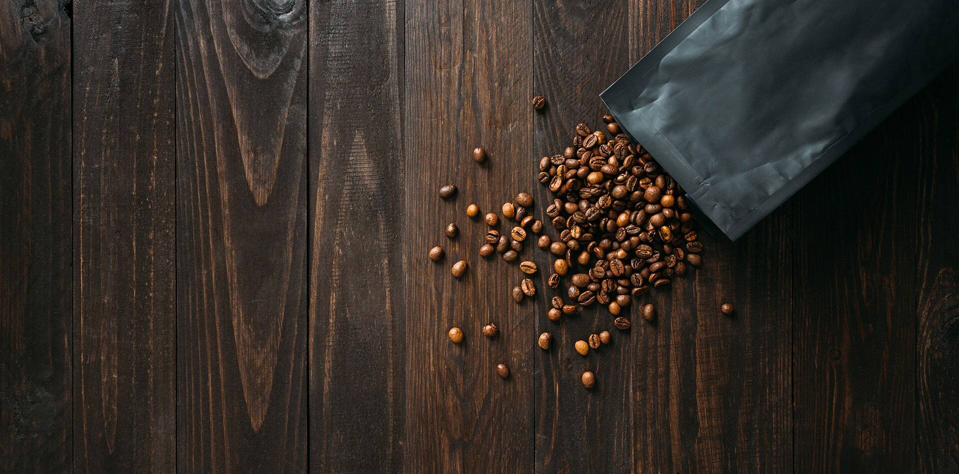 Your Coffee choice beans spilled on table