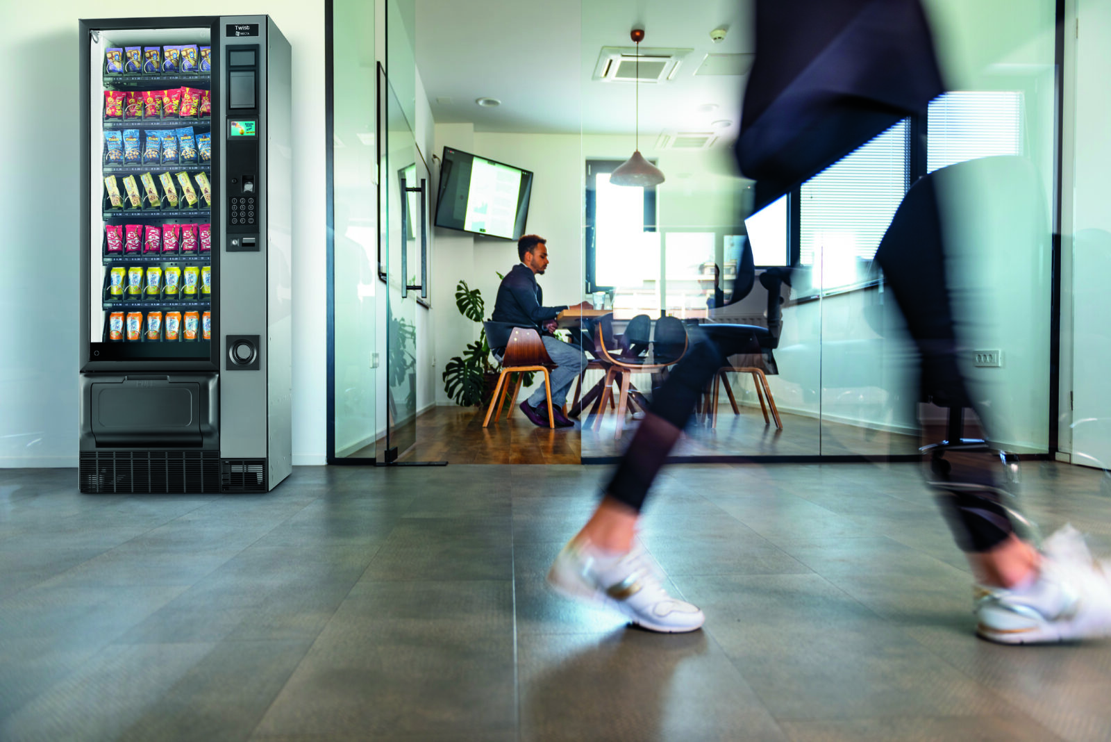 Lifestyle iamge of the Evoca Twist vending machine in an office space