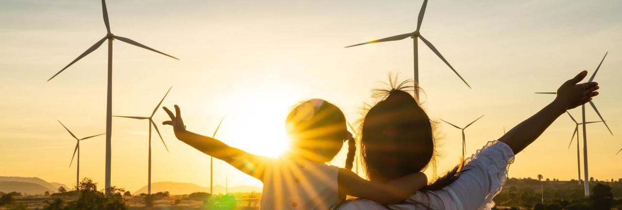 Wind turbines are alternative electricity sources, the concept of sustainable resources, People in the community with wind generators turbines, Renewable energy.