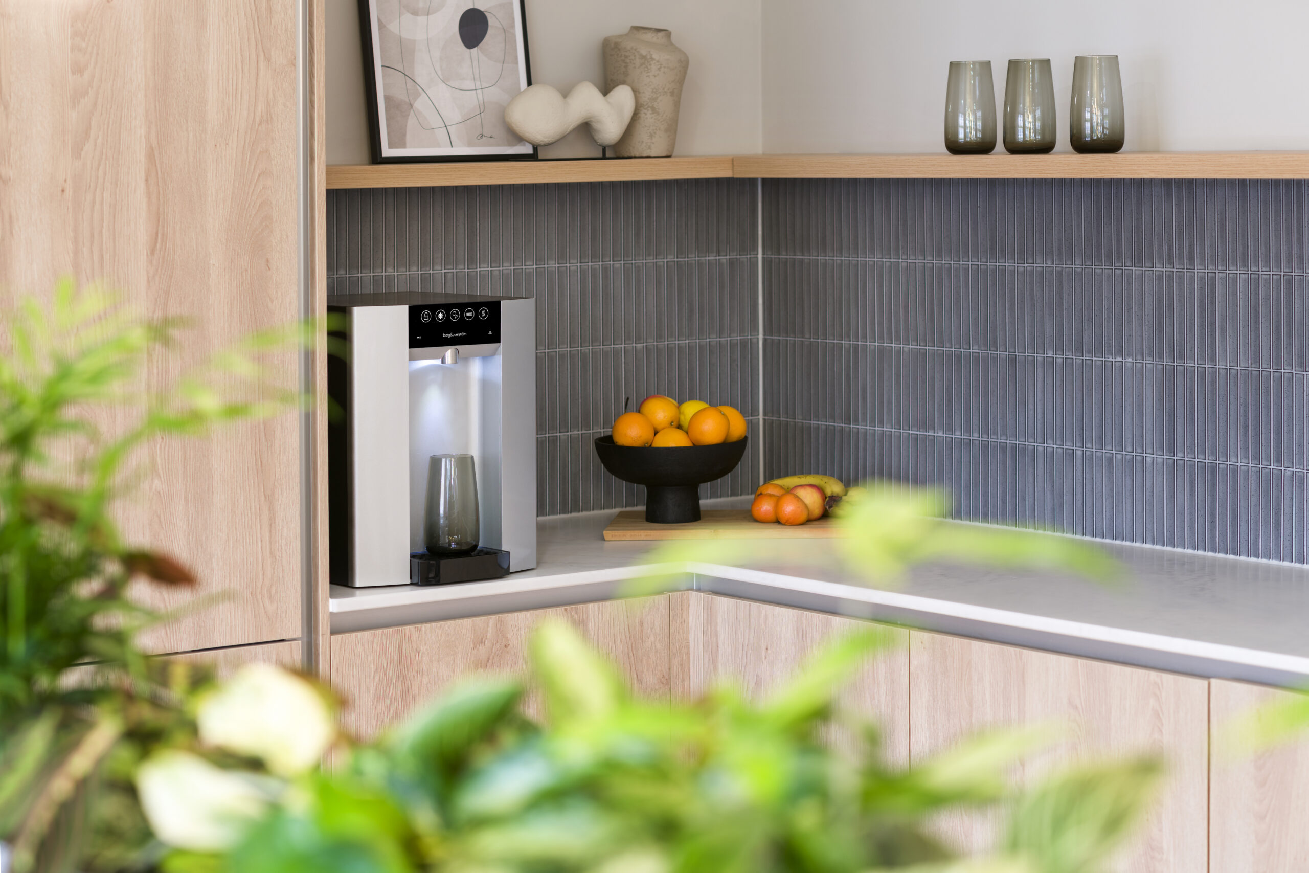 Borg & Overström E6 in kitchen next to fruit bowl