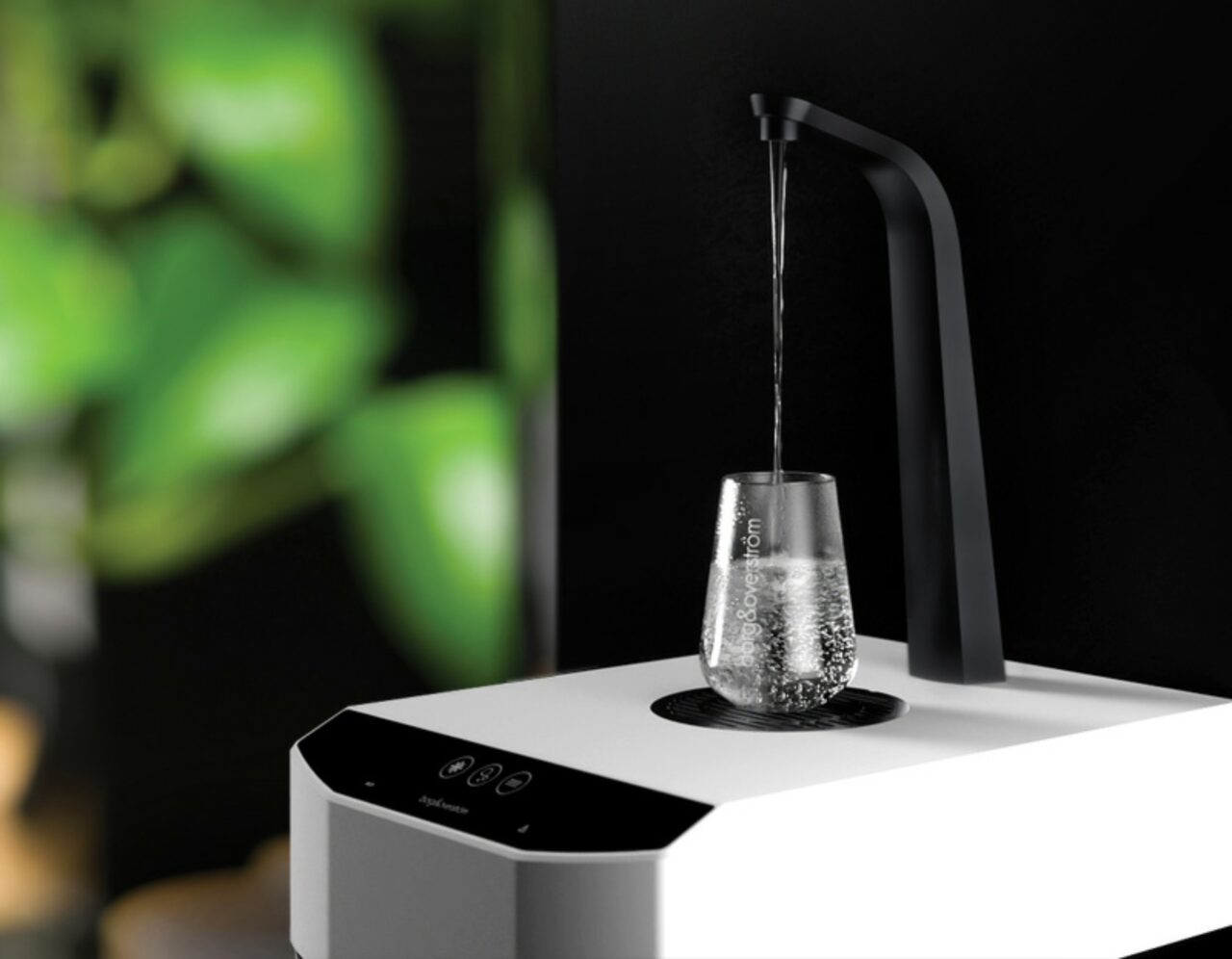 Borg & Overström E7 dispensing chilled water into a glass