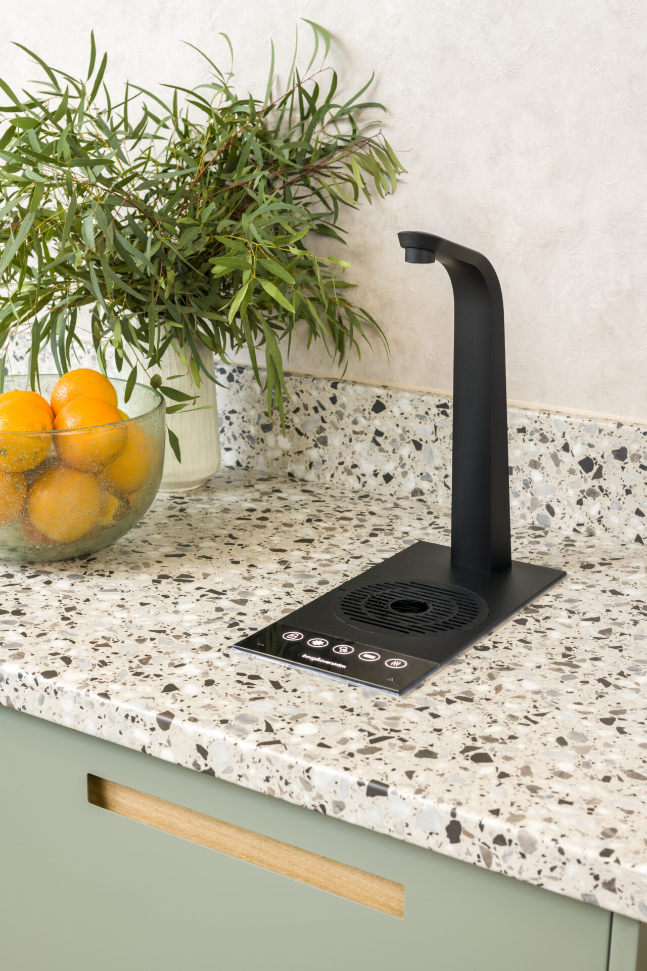 Borg & Overström T3 built into worktop, next to a bowl of oranges