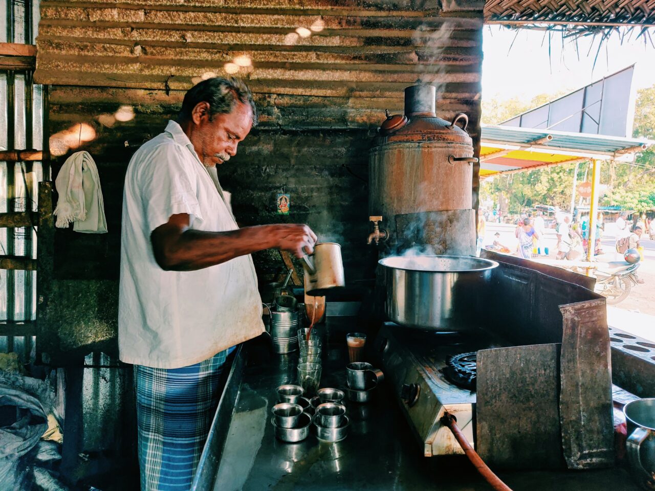 How Tea is Enjoyed Around the World: A man making chai tea