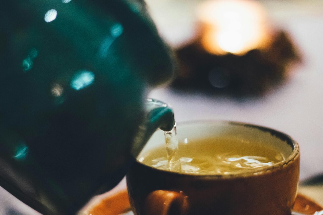 pouring ginger tea and tisanes that have health benefits and vitamins